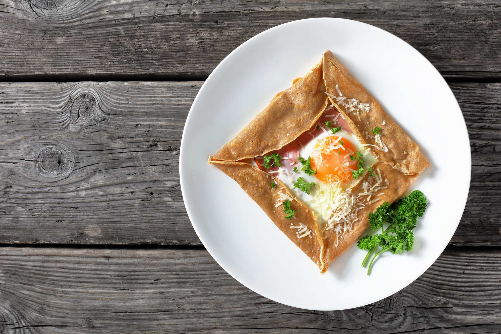 Breton crepe, Savory Buckwheat Galettes Bretonnes with fried egg, cheese, ham